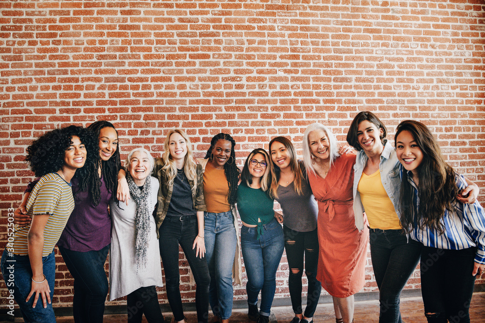 Happy diverse women in a row